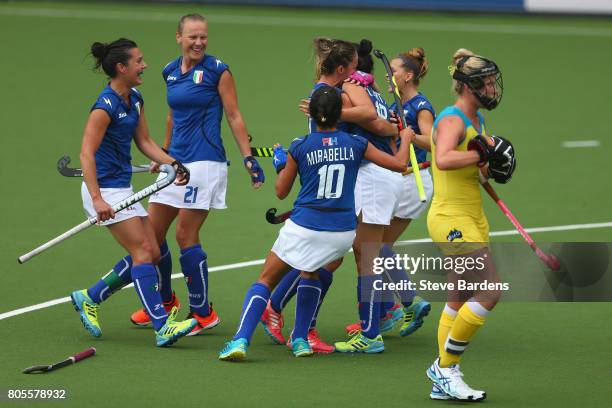 Federica Carta of Italy celebrates scoring a goal from a penalty corner with her team mates during the 5/6th place play off match between Italy and...