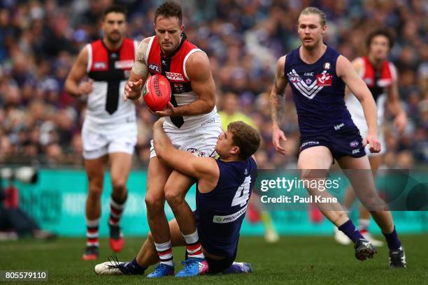 Sean Darcy of the Dockers tackles Nathan Brown of the Saints during the round 15 AFL match between the Fremantle Dockers and the St Kilda Saints at...