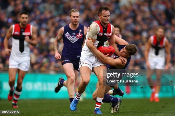 Sean Darcy of the Dockers tackles Nathan Brown of the Saints during the round 15 AFL match between the Fremantle Dockers and the St Kilda Saints at...