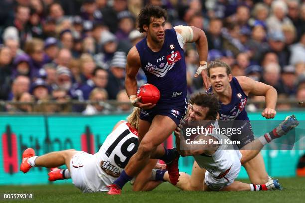 Brady Grey of the Dockers looks to pass the ball during the round 15 AFL match between the Fremantle Dockers and the St Kilda Saints at Domain...