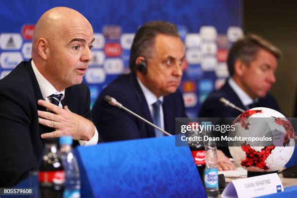 President Gianni Infantino speaks to the media as Vitaly Mutko, Russian Federation Deputy Prime Minister & Local Organising Committee Chairman and...