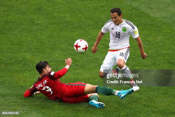 Andre Silva of Portugal tackles Andres Guardado of Mexico during the FIFA Confederations Cup Russia 2017 Play-Off for Third Place between Portugal...