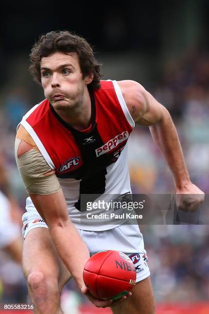 Dylan Roberton of the Saints handballs during the round 15 AFL match between the Fremantle Dockers and the St Kilda Saints at Domain Stadium on July...