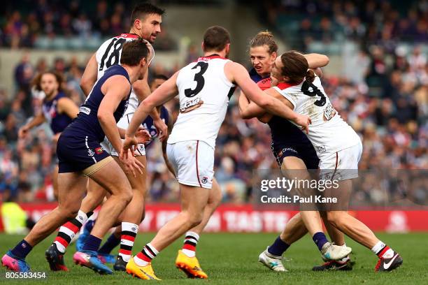 Nathan Fyfe of the Dockers gets tackled by Jack Steele of the Saints during the round 15 AFL match between the Fremantle Dockers and the St Kilda...