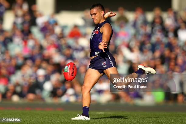 Michael Walters of the Dockers kicks the ball into the forward line during the round 15 AFL match between the Fremantle Dockers and the St Kilda...