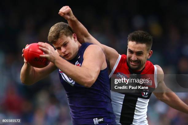 Sean Darcy of the Dockers marks the ball against Billy Longer of the Saints during the round 15 AFL match between the Fremantle Dockers and the St...