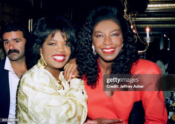 Oprah Winfrey and Singer Natalie Cole at Tyson vs Spinks Convention Hall in Atlantic City, New Jersey June 27 1988.