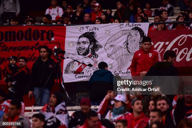 Fans of River Plate display banners during Fernando Cavenaghi's farewell match at Monumental Stadium on July 01, 2017 in Buenos Aires, Argentina.