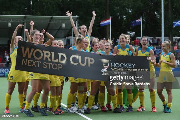 The Australia players celebrate their qualification for the 2018 World Cup after their victory over Italy in the 5/6th place play off match between...