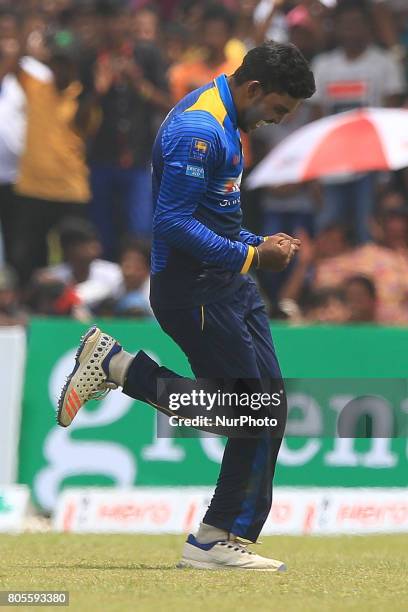 Sri Lankan cricketer Wanidu Hasaranga celebrates after he completed taking a hat-trick of wickets against Zimbabwe during the 2nd One Day...