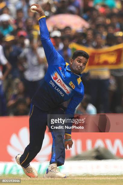 Sri Lankan cricketer Wanidu Hasaranga delivers the ball that completed a hat-trick of wickets against Zimbabwe during the 2nd One Day International...