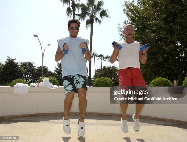 Dean Cain, left, works out with trainer David Kirsch at the Majestic Barriere Hotel in Cannes prior to the Vincent Longo 5th Anniversary celebration...