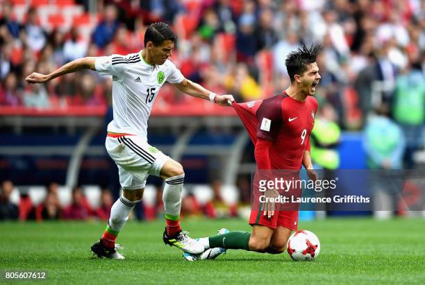 Hector Moreno of Mexico fouls Andre Silva of Portugal during the FIFA Confederations Cup Russia 2017 Play-Off for Third Place between Portugal and...