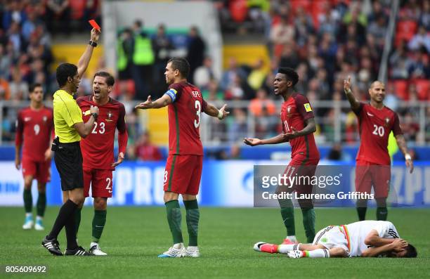 Nelson Semedo of Portugal is shown a red card by Referee Fahad Al Mirdasi during the FIFA Confederations Cup Russia 2017 Play-Off for Third Place...
