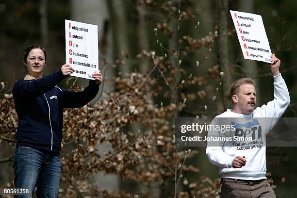 Activists protest during the first presentation of polar bear cub Flocke to the media at the Nuremberg Zoo on April 8, 2008 in Nuremberg, Germany....