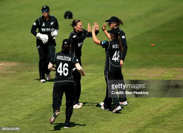 Lea Tahuhu of New Zealand celebreates with team mates after dismissing Beth Mooney of Australia during the ICC Women's World Cup 2017 match between...