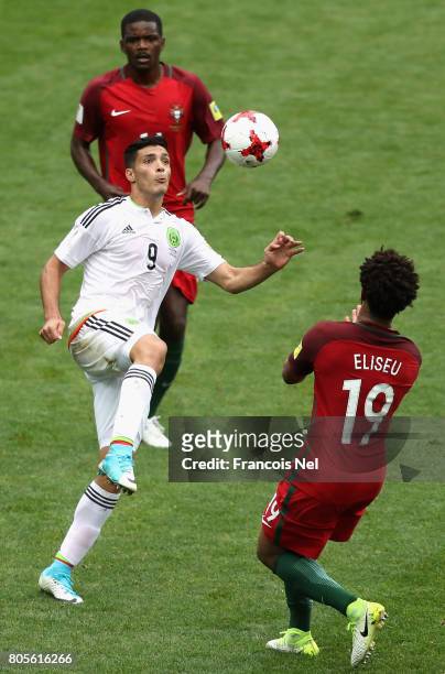 Raul Jimenez of Mexico and Eliseu of Portugal battle to win a header during the FIFA Confederations Cup Russia 2017 Play-Off for Third Place between...