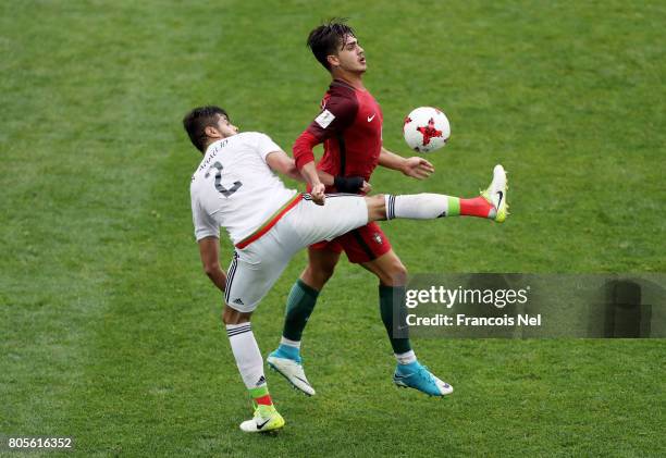 Mexico and Andre Silva of Portugal battle for possession during the FIFA Confederations Cup Russia 2017 Play-Off for Third Place between Portugal and...