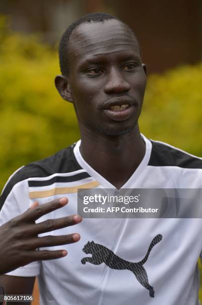 James Nyang Chiengjiek, a South Sudanese refugee and 400m Olympian at the Rio Olympic Games talks at a training camp on May 12, 2017 following a...