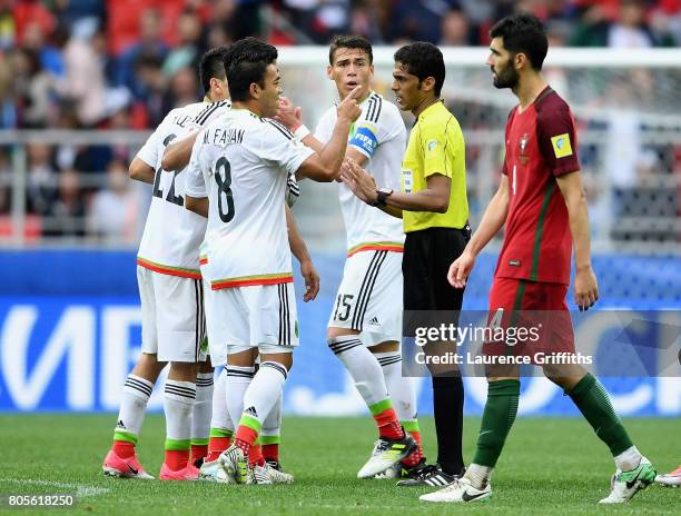 Marco Fabian of Mexico argues with Referee Fahad Al Mirdasi during the FIFA Confederations Cup Russia 2017 Play-Off for Third Place between Portugal...