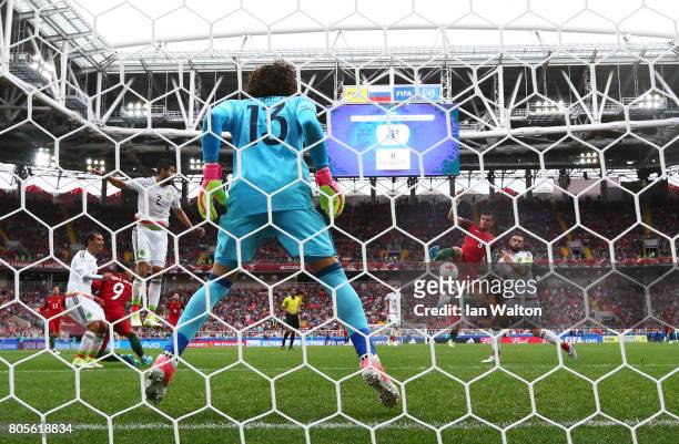 Pepe of Portugal scores his sides first goal past Guillermo Ochoa of Mexico during the FIFA Confederations Cup Russia 2017 Play-Off for Third Place...