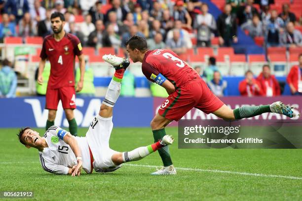 Pepe of Portugal fouls Hector Moreno of Mexico during the FIFA Confederations Cup Russia 2017 Play-Off for Third Place between Portugal and Mexico at...