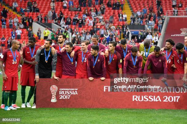 Portugal's players pose with their bronze medals at the end of the 2017 FIFA Confederations Cup third place football match between Portugal and...