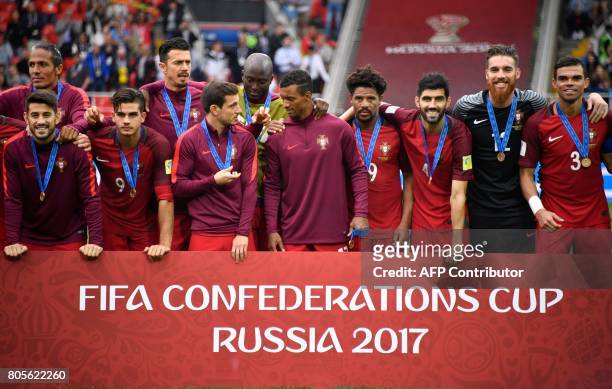 Portugal's players pose with their bronze medals at the end of the 2017 FIFA Confederations Cup third place football match between Portugal and...