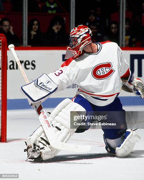 Patrick Roy of the Montreal Canadiens tends goal in game played at Montreal Forum .