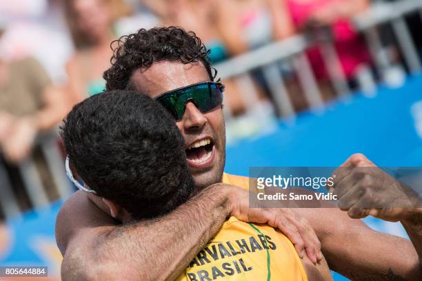 Gustavo Carvalhaesv and Pedro Solberg Salgado of Brazil celebrate winning the the gold medal match against Daniele Lupo and Paolo Nicolai of Italy...