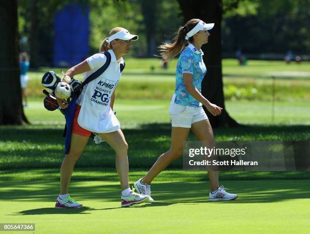 Klara Spilkova of the Czech Republic walks with her caddie on the 18th hole during the final round of the 2017 KPMG Women's PGA Championship at...