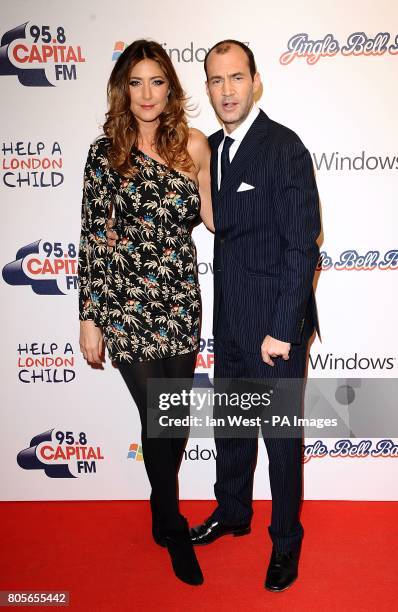 Johnny Vaughn and Lisa Snowdon in the press room of Capital FM's Jingle Bell Ball at the O2 Arena in London.