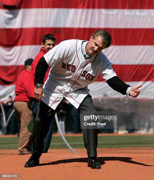 Former Boston Red Sox Bill Buckner gestures after throwing the ceremonial first pitch before the start of the Red Sox home opener against the Detroit...