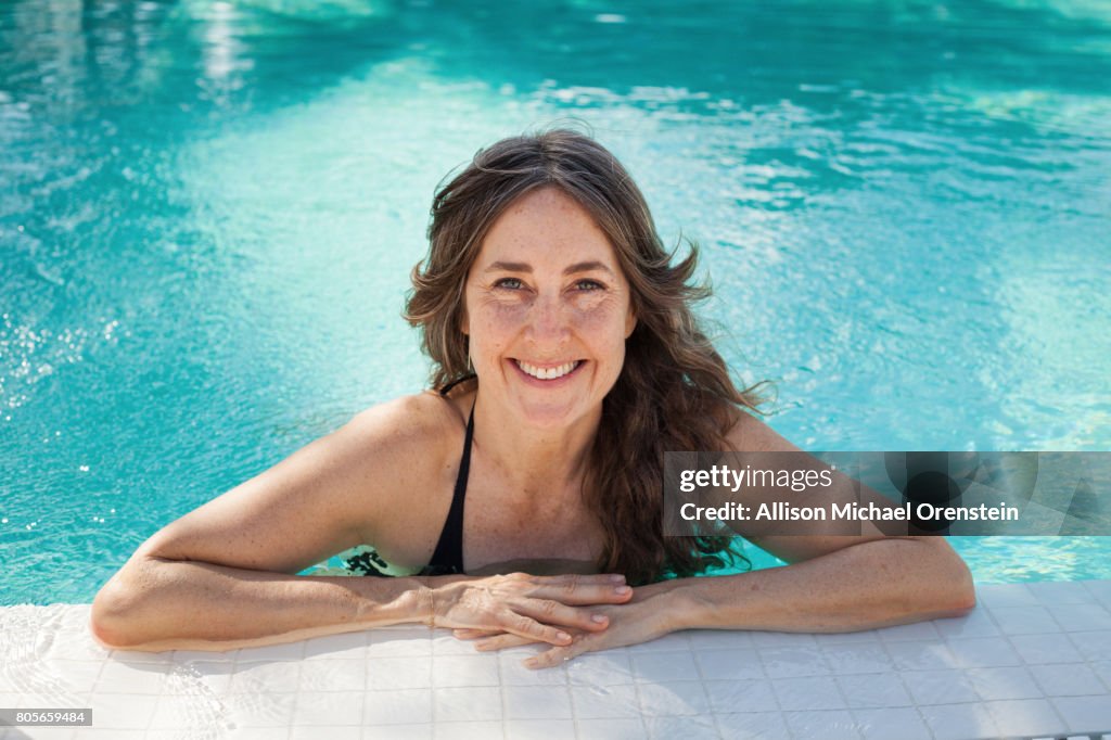 Woman in the pool smiling