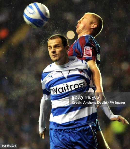 Reading's Marek Matejovsky wins a header during the Coca-Cola Championship match at the Madejski Stadium, Reading.