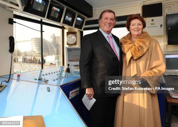 Sir Terry Wogan and his wife Helen celebrate being given the Freedom of The City of London by single-handedly raising Tower Bridge and then closing...