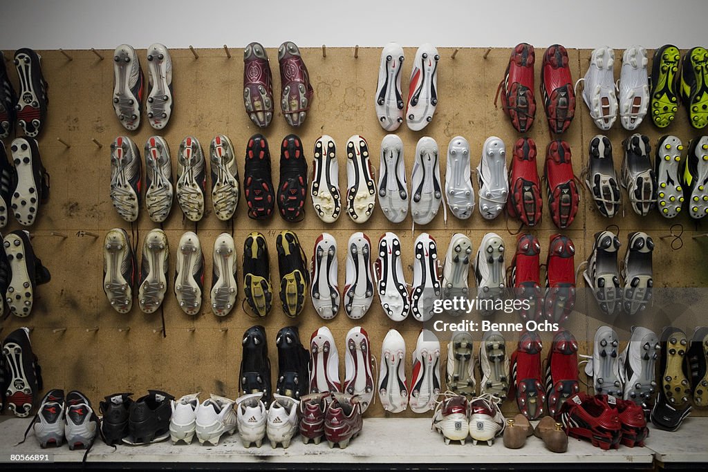 Football boots hanging on a wall