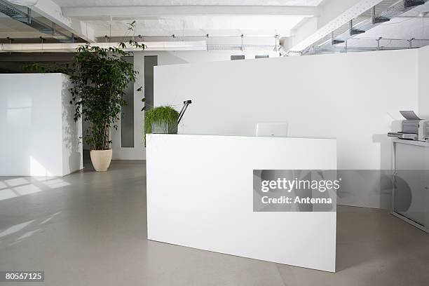 reception desk in the foyer of an office building - hotel lobby stock-fotos und bilder