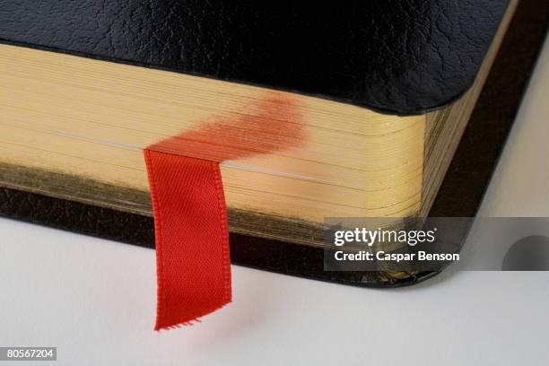 a bookmark in a book - segnalibro foto e immagini stock