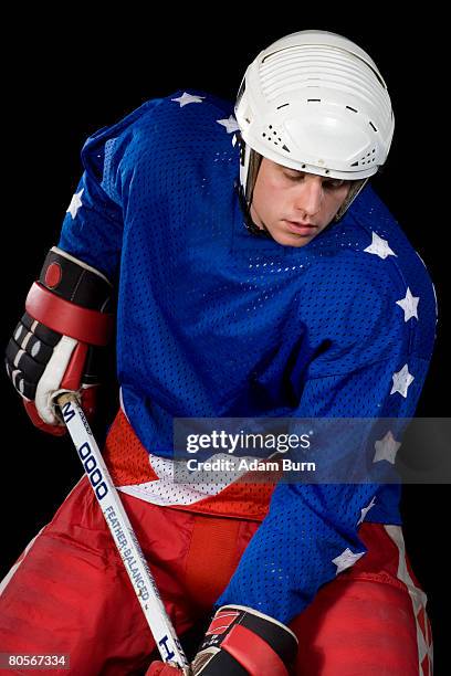 an ice hockey player - hockey player black background stock pictures, royalty-free photos & images