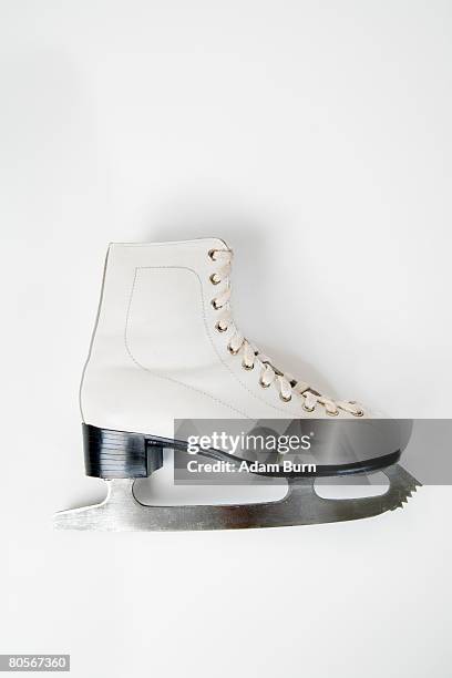 a still life studio shot of an ice skate - pattino da ghiaccio foto e immagini stock