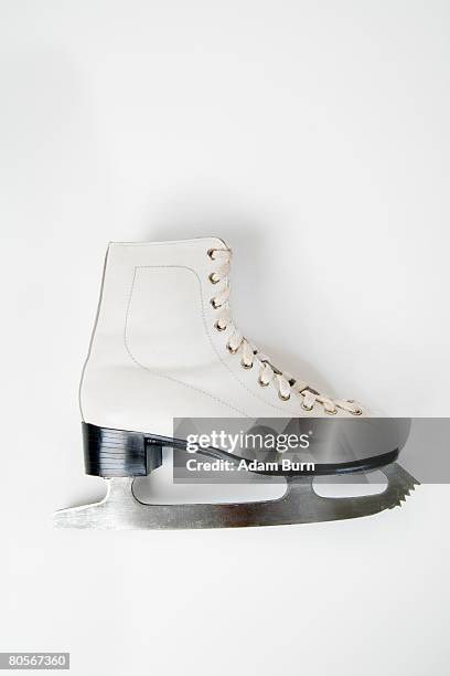 a still life studio shot of an ice skate - アイススケート ストックフォトと画像