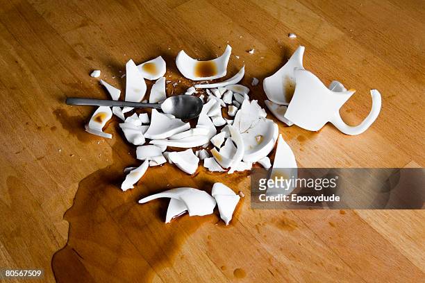 a smashed cup of coffee - broken cup stock-fotos und bilder