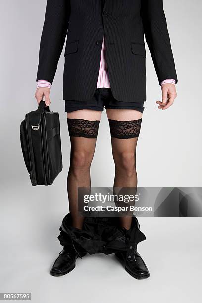 a businessman with his trousers around his ankles and wearing stockings - pants down bildbanksfoton och bilder