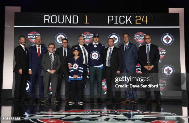 And assistant general manager Larry Simmons, head European scout Evgeny Bogdanovich, director of hockey operations and assistant general manager...