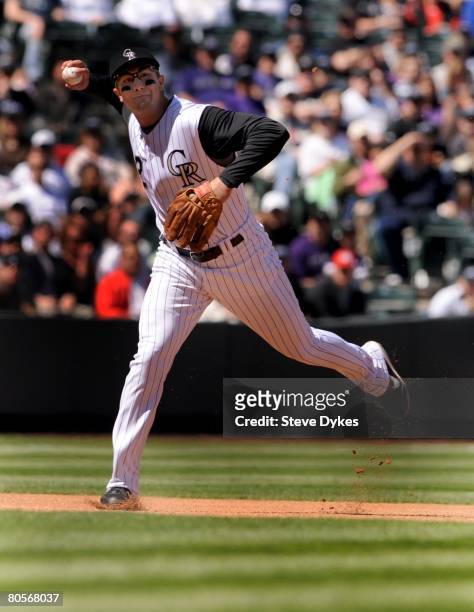 Troy Tulowitzki of the Colorado Rockies makes a play on a ball during the MLB game against the Arizona Diamondbacks at Coors Field on April 6, 2008...