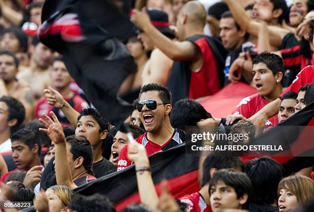 Fans of Atlas from Mexico, celebrate their victory against Boca Juniors from Argentina, during their Libertadores Cup match in Guadalajara, Mexico,...