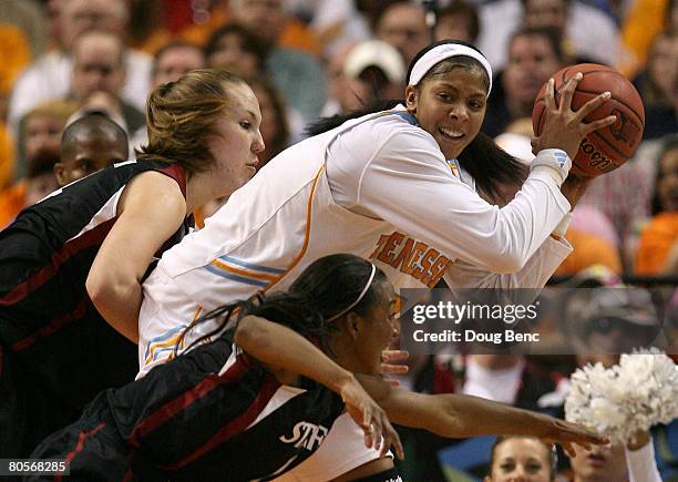 Candace Parker of the Tennessee Lady Volunteers looks to pass the ball against Kayla Pedersen and Candice Wiggins of the Stanford Cardinal during the...