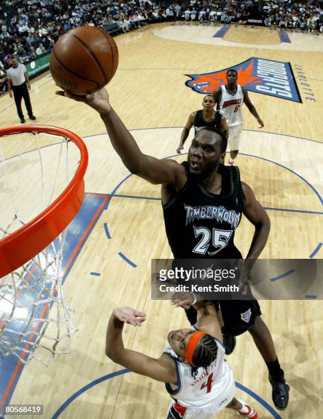 Al Jefferson of the Minnesota Timberwolves shoots against Jared Dudley of the Charlotte Bobcats on April 8, 2008 at the Time Warner Cable Arena in...