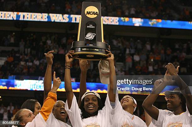 The Tennessee Lady Volunteers celebrate with the championship trophy after their 64-48 win against the Stanford Cardinal during the National...